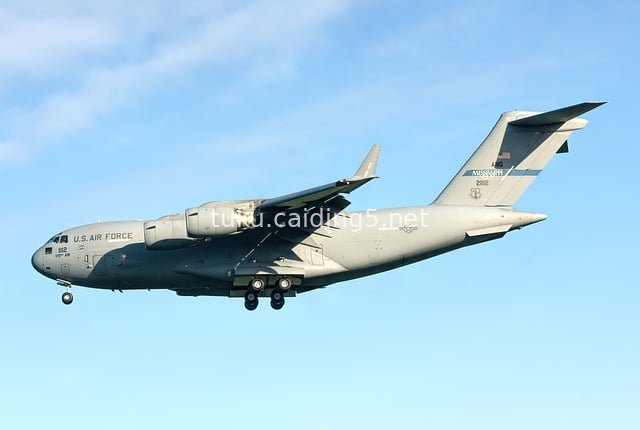 US Air Force C-17 Globemaster Transport Aircraft Flying in the Blue Sky