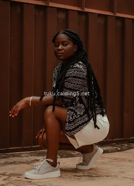 Portrait Photography Material of a Ghanaian Black Woman in a Stylish Squat Pose