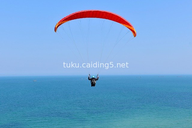 Paragliding Over Azure Seas and Blue Skies: Thrilling Aerial Flight