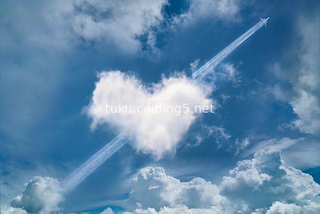 Heart-Shaped Cloud and Plane Contrail: Romantic Sky Beauty