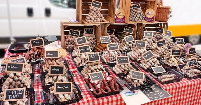 Diverse Sausage Stalls at a Food Market: A Vibrant Display with Lively Atmosphere