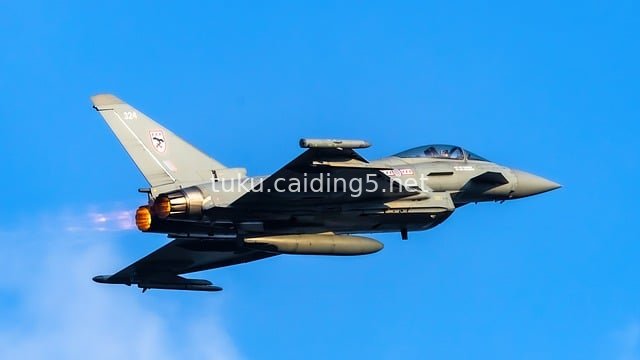 Eurofighter Typhoon in Afterburner Flight: Military Moment of Soaring in the Blue Sky