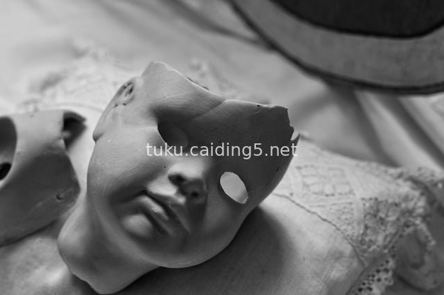 Vintage Broken Doll Black-and-White Photography: Dark Nostalgic Toy Still Life