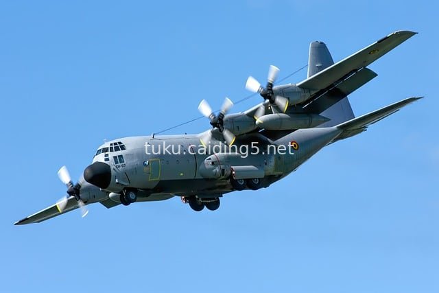 HD Image of C-130 Hercules Military Transport Aircraft Flying in the Blue Sky