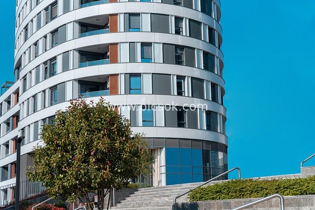 Modern Circular Commercial Office Building with Urban Blue Sky Landscape