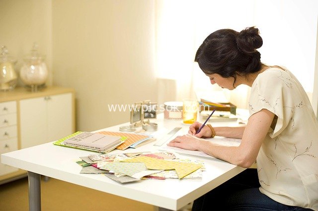 Office Scene of a Young Professional Woman Focused on Creative Work