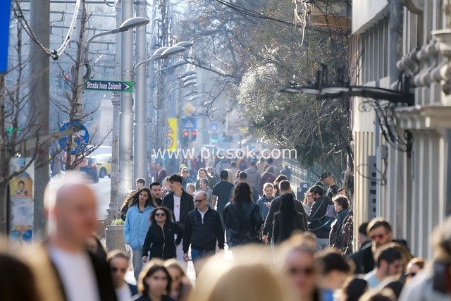 Vibrant Crowds and Urban Life on a Weekend City Street