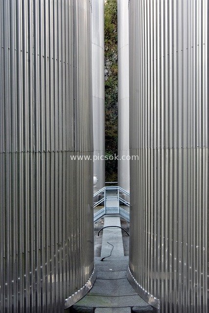 Brewery Fermentation Tank Cluster: Metallic Geometric Cool-Toned Industrial Scene