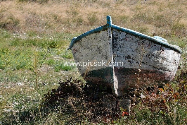 Abandoned Old Boat in a Dry Grassy Wasteland
