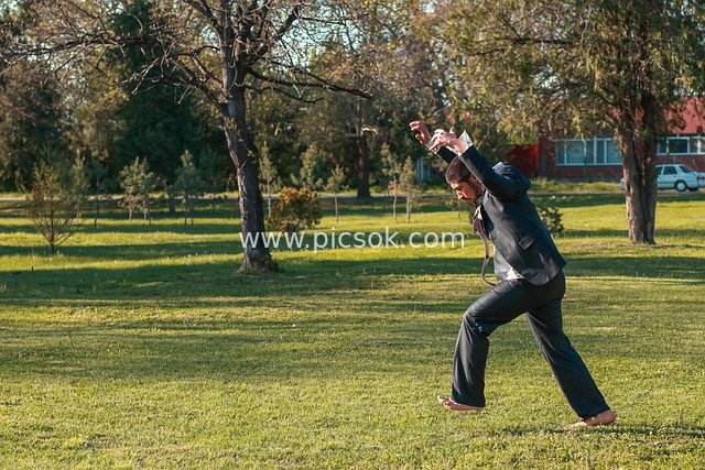 Vibrant Scene of a Suit-Clad Man Unleashing Emotions on a Park Lawn