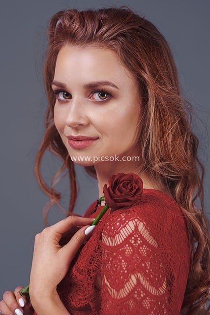 Elegant Woman Holding a Red Rose: Romantic Valentine's Day Portrait