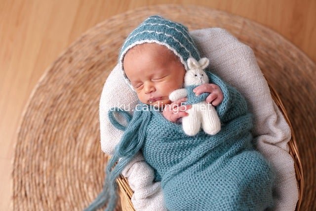 Sleeping Newborn Wrapped in Blue-Green Knit Blanket with Mini White Rabbit Toy – Warm Children’s Portrait