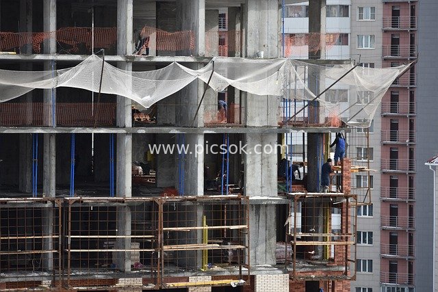 Real Shot of Construction Workers at Work on an Urban Construction Site