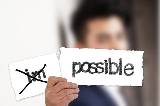 Business Professional Tears Away 'Impossible' to Embrace 'Possible' Opportunities