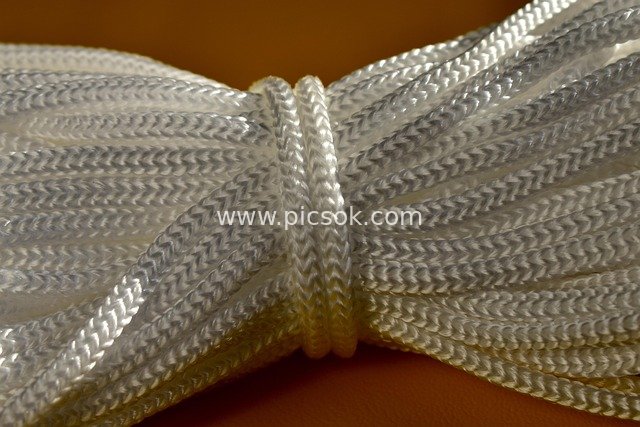 Close-up of White Braided Rope Texture – Garment Accessory Material