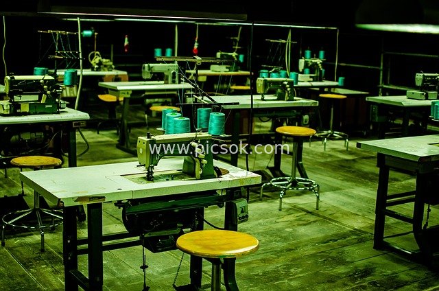 Retro Sewing Workshop: Industrial Scene of Sewing Machines and Work Chairs