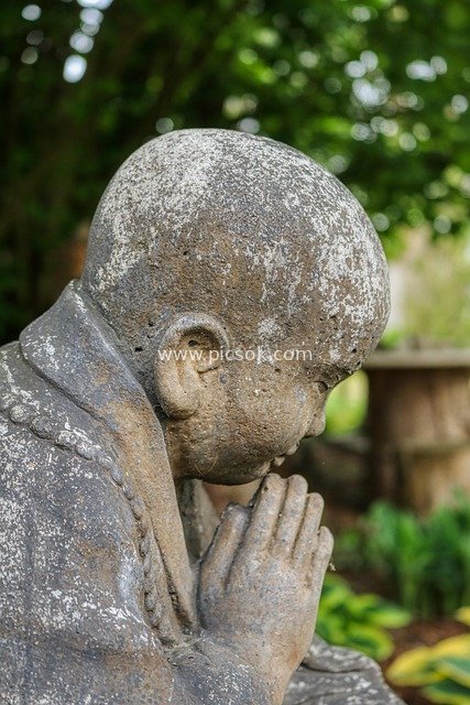 Outdoor Stone Statue of a Young Monk: Zen Scene of Praying with Hands Clasped