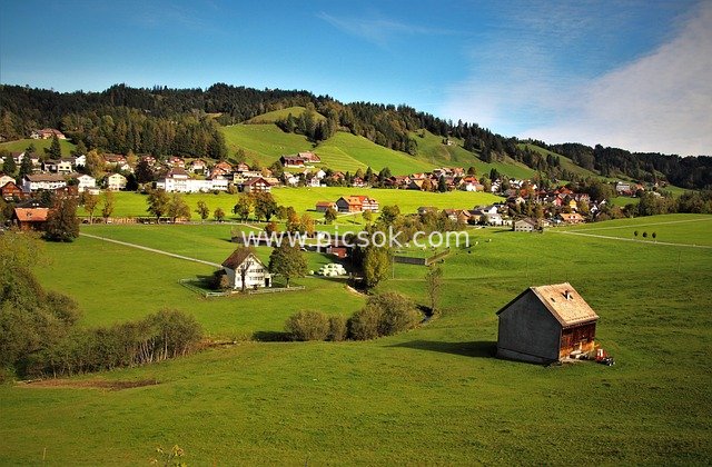 Alpine Village Scenery: Green Hillsides, Meadows and Chalets