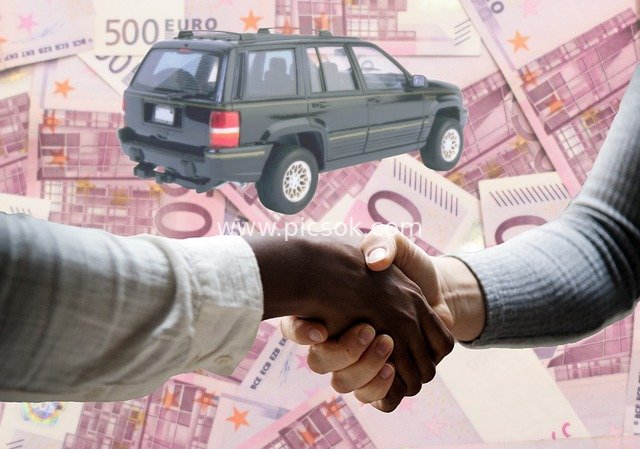 Used Car Sale: Euro Cash Handshake at Deal Closing