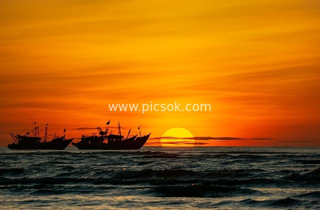 Silhouetted Fishing Boats at Sunset on Vietnam’s Coast - Stunning Natural Seascape