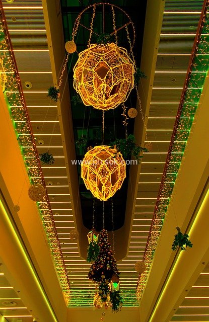 New Year Festival Decorations in Commercial Building: Sparkling Spherical Lights and Christmas Tree