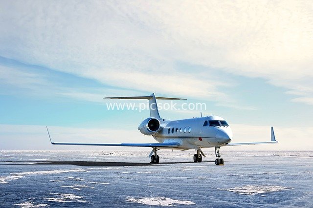 White Gulfstream Private Business Jet Amidst Snow and Ice