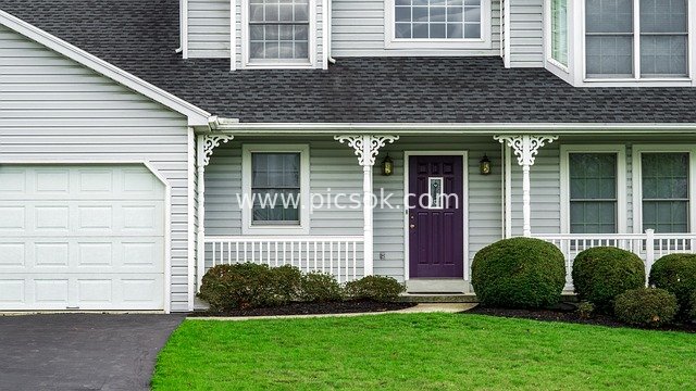 Exterior of American Suburban House - Purple Door + Gray Exterior + Lush Green Lawn