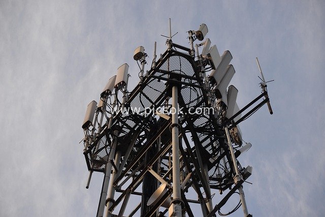 5G/4G Communication Tower: Close-up of Antennas and Transmission Equipment