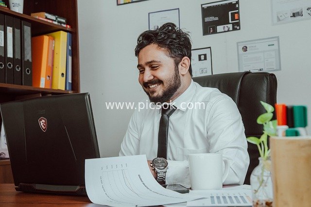 Businessman Focused on Work in Office - Workplace Office Scene Material