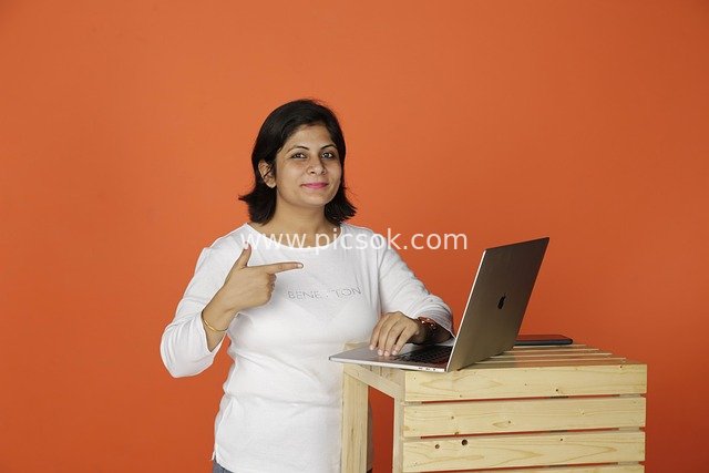 Professional Working Woman Operating Laptop in Business Scene