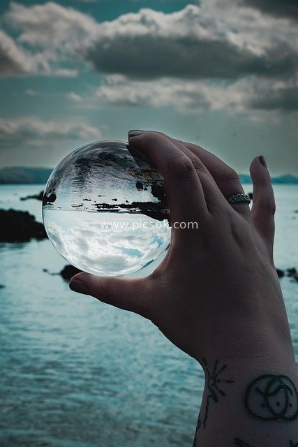 lens ball, sunset, crystal ball, ocean, beach, overcast, sky, rock, rock pools, holiday, atlantic ocean, inverted, water reflection