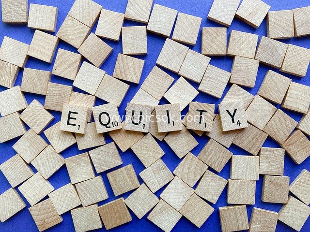 Wooden Blocks Spelling 'Equity': Theme of Diversity, Equity and Unity