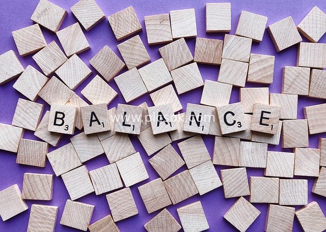 Creative Design Material with Wooden Letters Spelling 'BALANCE' on Purple Background