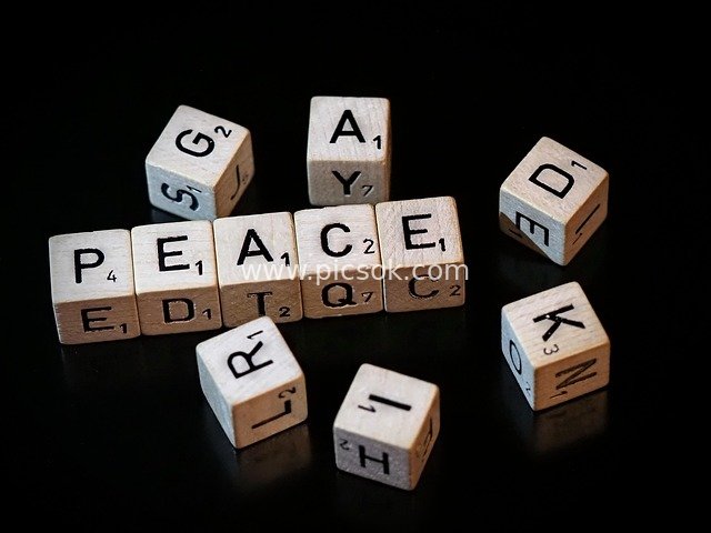 Scrabble Letter Tiles Forming 'PEACE' - Creative Word Game Material