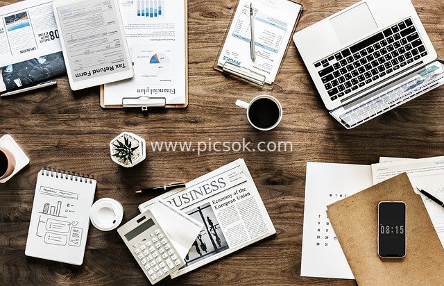 Top-down Flat Lay of a Business Office Desk: Startup Financial Analysis Scene