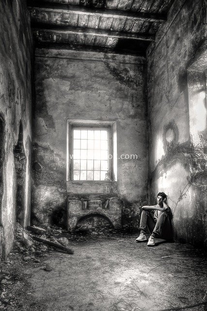 Melancholic Addicted Moment: A Lonely Man in a Dilapidated Abandoned Room (Black-and-White)