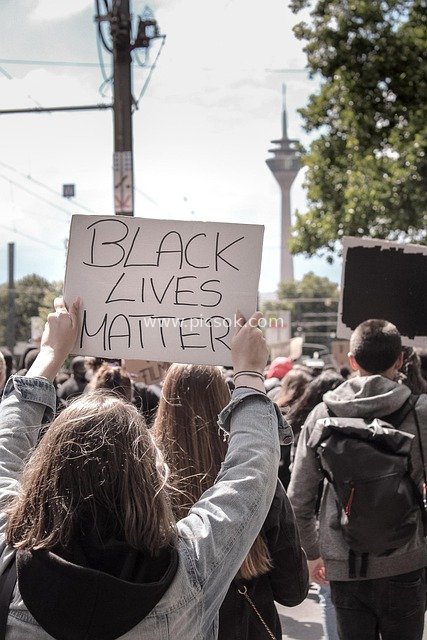 Black Lives Matter Protest Scene: Demonstrators Hold Signs in Support of Racial Justice