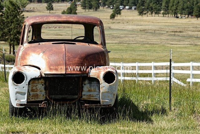 Rusty Abandoned Old Truck in Retro Outdoor Grassland Scene