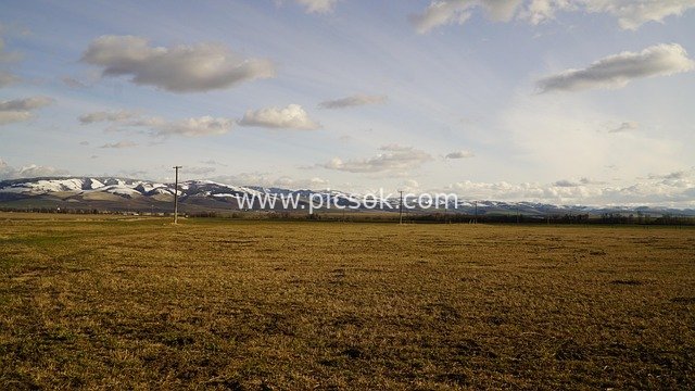 Winter Rural Landscape with Snowy Mountains and Farmlands in Palouse, Washington, USA