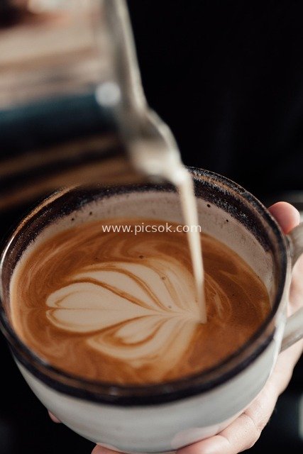 Coffee Latte Art: Romantic Milk Foam Patterns in a Latte Cup