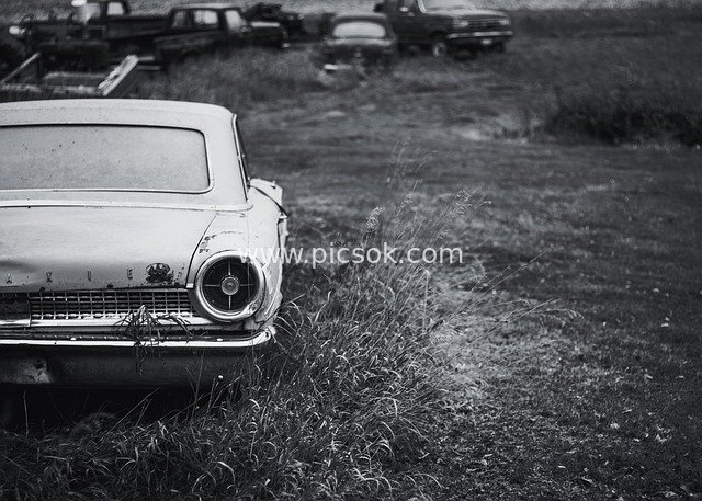 Black-and-White Retro Old Car: Rusty Classic Abandoned Vehicle in the Field