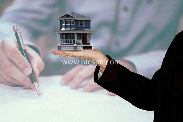 Real Estate Transaction Signing: Mini House Model Showcases Commercial Property Purchase Scene