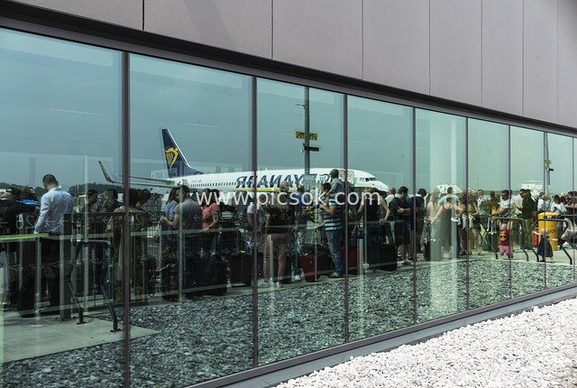 Busy Scene of Passengers Waiting for Boarding in the Airport Departure Lounge