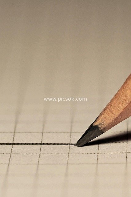 Macro Close-Up of Pencil Drawing Lines & Graph Paper Writing Material