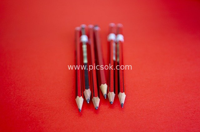 Close-Up of Red Pencils on Red Background | Drawing & Writing Tool Material