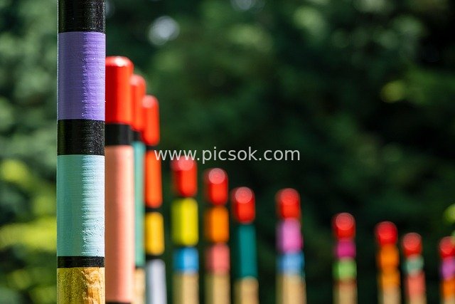 Creative Decoration with Colorful Wooden Poles: Art Installation Against Natural Background
