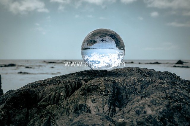 lens ball, sunset, crystal ball, ocean, beach, overcast, sky, rock, rock pools, holiday, atlantic ocean, inverted, water reflection