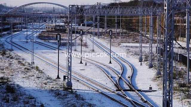 Winter Urban Railway Snow Scene: Snow-Covered Tracks and Electrification Facilities