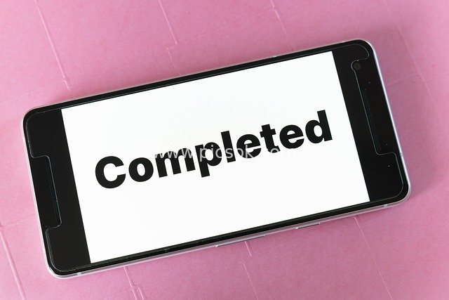 Smartphone Screen Displaying 'Completed' - Task Completion & Project Management Scene
