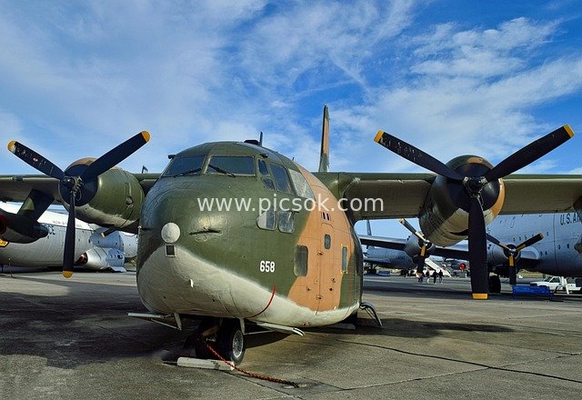 Camouflage Propeller Military Transport Aircraft on Display at Aviation Museum